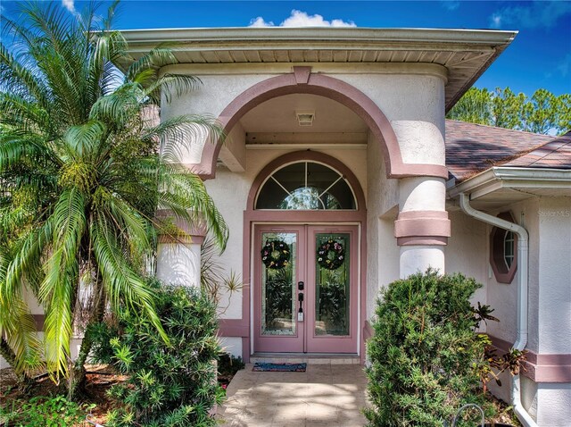 property entrance featuring french doors