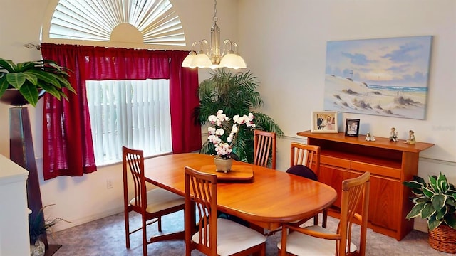 dining space with a healthy amount of sunlight and a chandelier