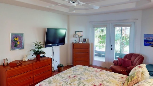 bedroom with ceiling fan, hardwood / wood-style flooring, access to outside, and french doors