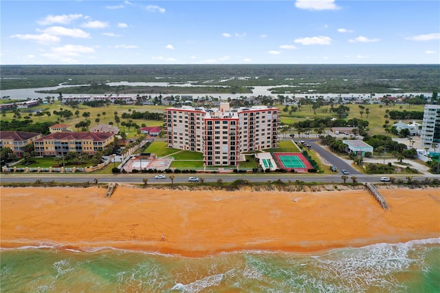 birds eye view of property featuring a view of the beach and a water view