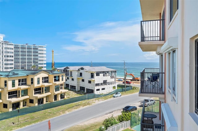 balcony featuring a water view