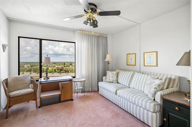 carpeted living room featuring ceiling fan and a textured ceiling