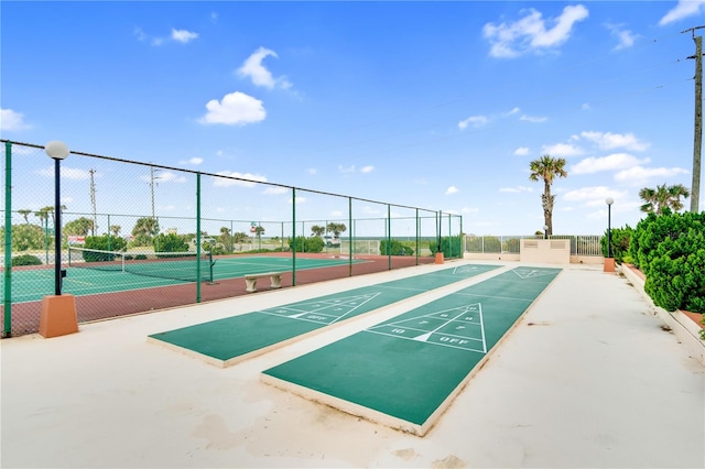 surrounding community featuring tennis court