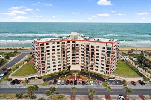 drone / aerial view with a view of the beach and a water view