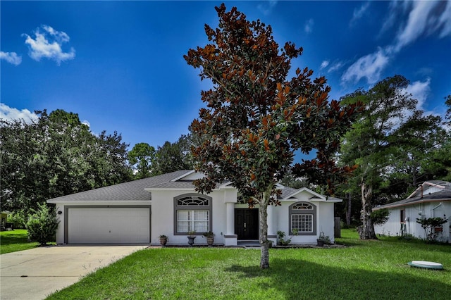 ranch-style home with a garage and a front lawn