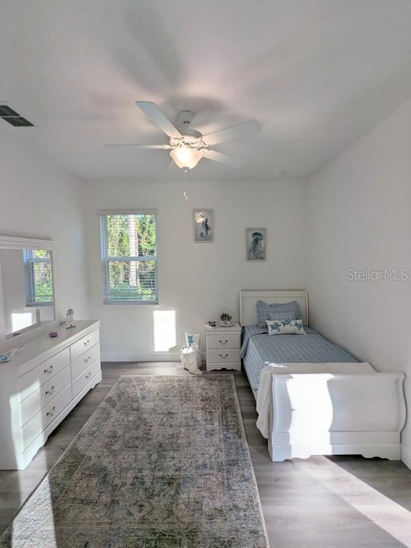 bedroom featuring ceiling fan and hardwood / wood-style flooring