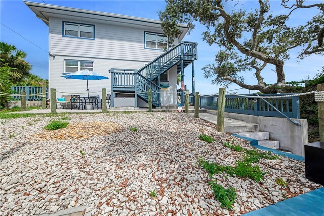 rear view of property with a patio area and a deck