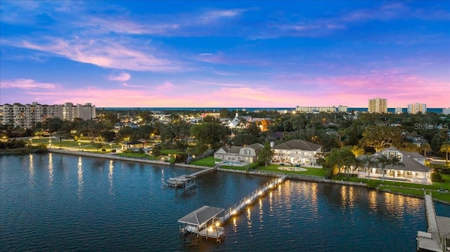 aerial view at dusk with a water view