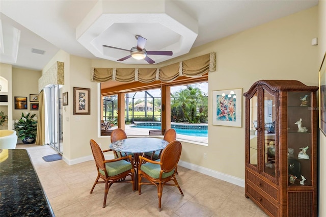 tiled dining room with ceiling fan