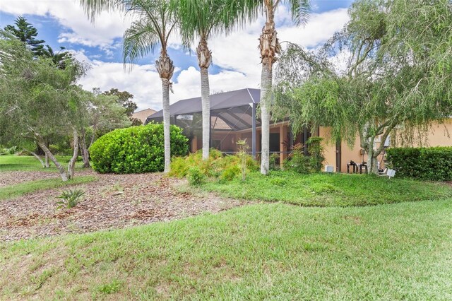 view of yard with a lanai