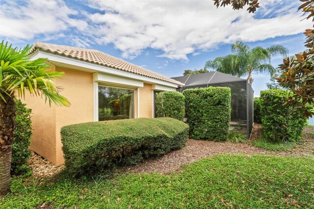 view of property exterior featuring a lanai