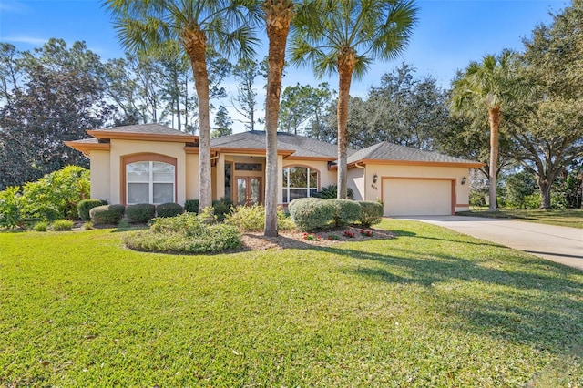 view of front facade with a garage and a front yard