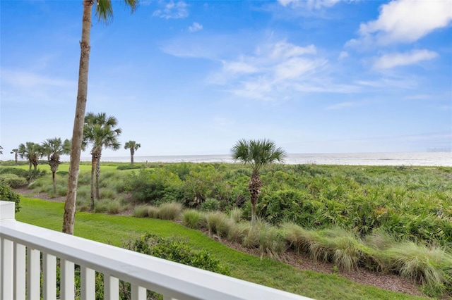 exterior space with a water view and a beach view