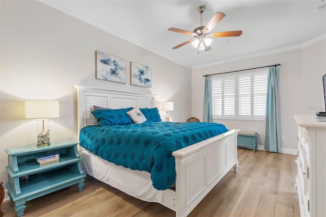 bedroom with light wood-type flooring, ornamental molding, and ceiling fan