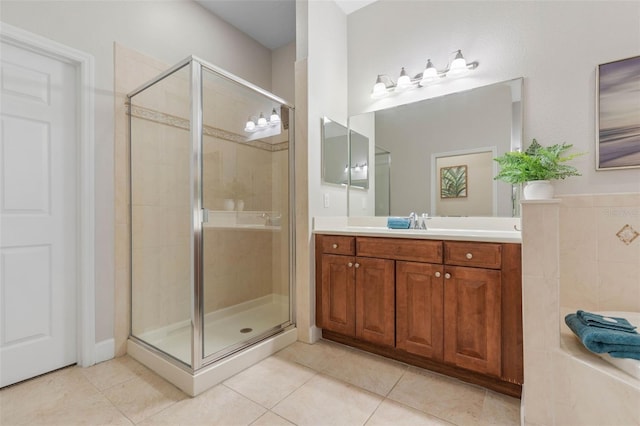 bathroom with vanity, tile patterned flooring, and an enclosed shower