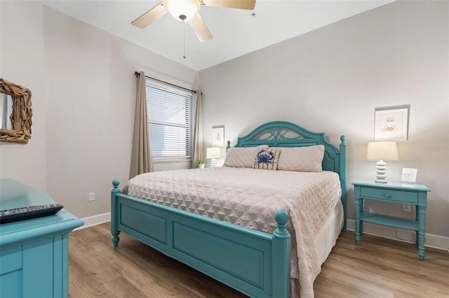 bedroom featuring ceiling fan and light hardwood / wood-style flooring