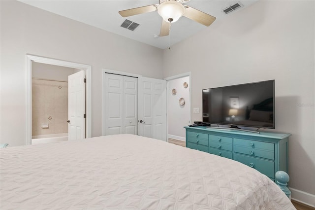 bedroom with wood-type flooring, ceiling fan, ensuite bathroom, and a closet