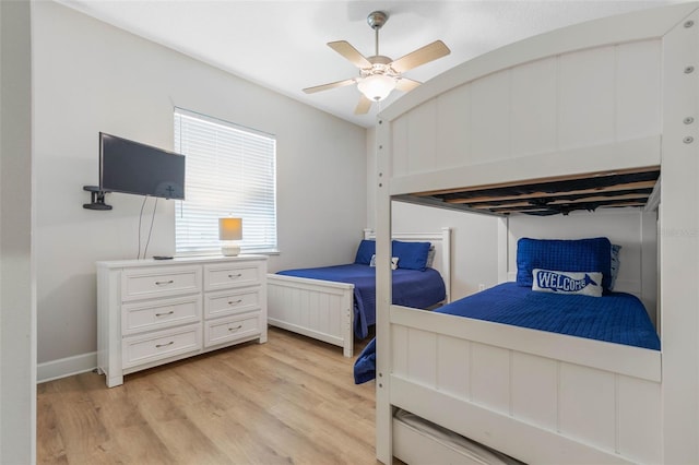 bedroom with light hardwood / wood-style floors and ceiling fan