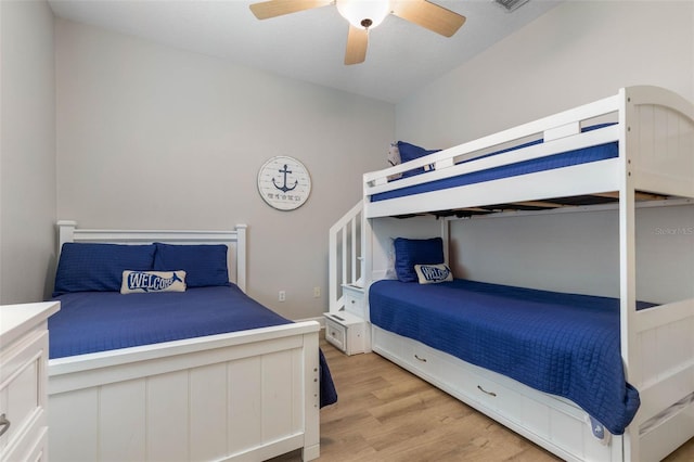 bedroom with light wood-type flooring and ceiling fan