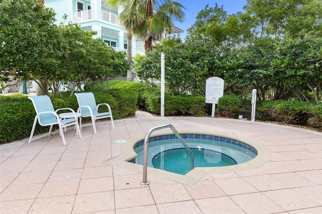 view of pool with a community hot tub