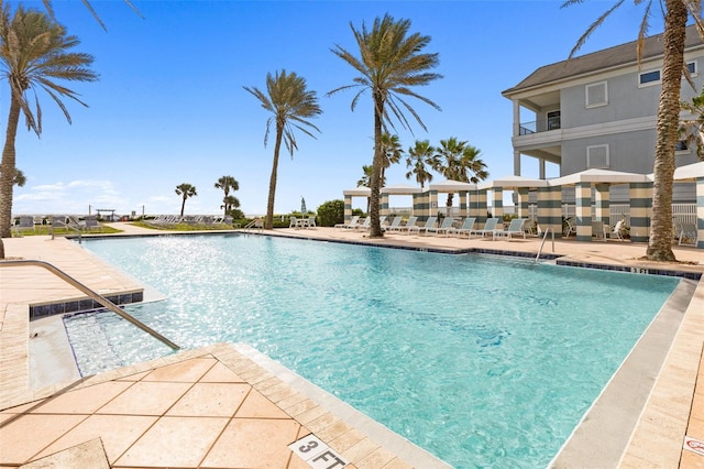 view of swimming pool featuring a patio area