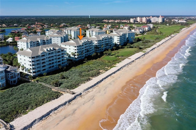 aerial view featuring a view of the beach and a water view