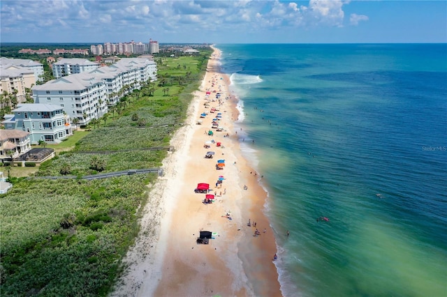 bird's eye view with a water view and a beach view