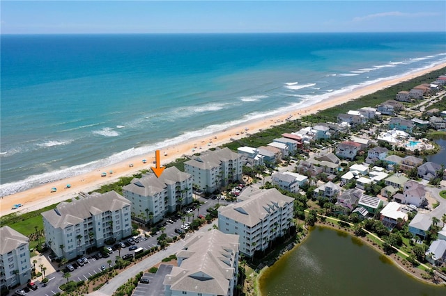 drone / aerial view with a view of the beach and a water view