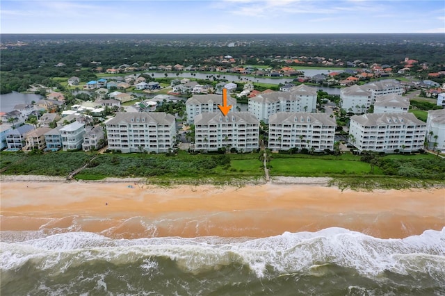 drone / aerial view featuring a view of the beach and a water view