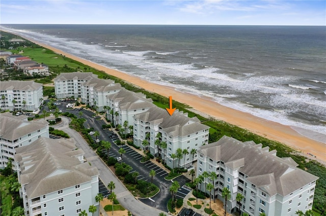 aerial view featuring a water view and a beach view