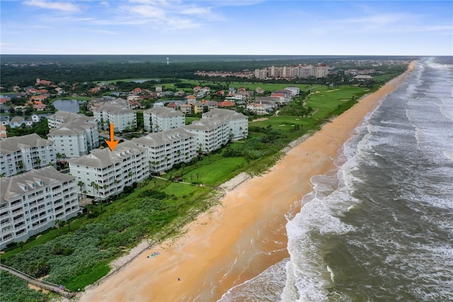 bird's eye view featuring a beach view and a water view