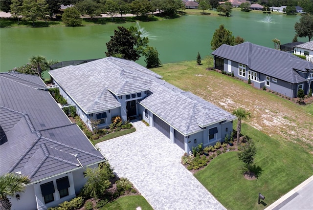 birds eye view of property with a water view