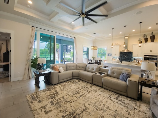 tiled living room with coffered ceiling, crown molding, sink, ceiling fan, and beam ceiling