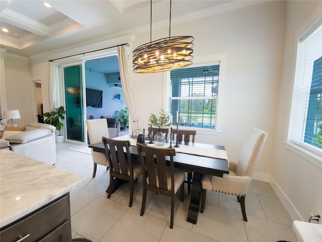 tiled dining room featuring crown molding, plenty of natural light, and a chandelier