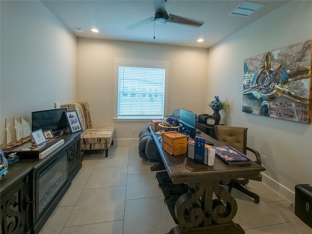 interior space with light tile patterned floors and ceiling fan