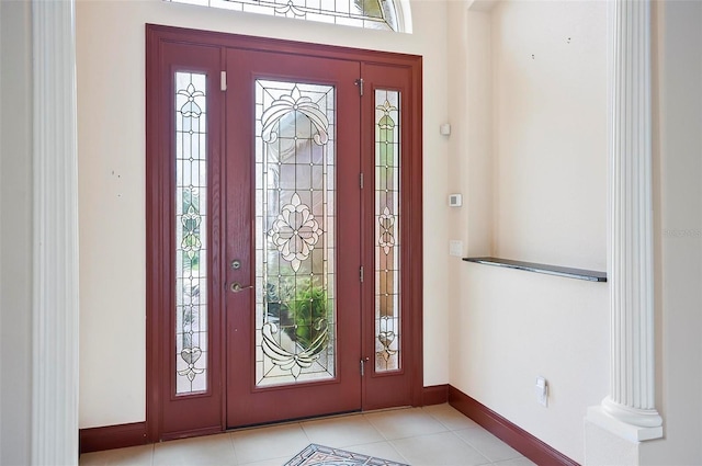 tiled entryway with ornate columns