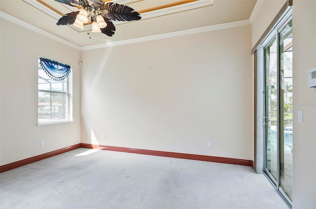 unfurnished room featuring ceiling fan, carpet floors, crown molding, and a healthy amount of sunlight