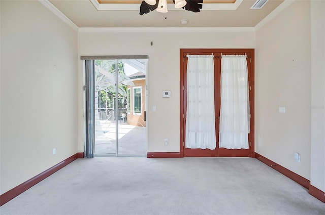 spare room featuring crown molding, light colored carpet, and ceiling fan