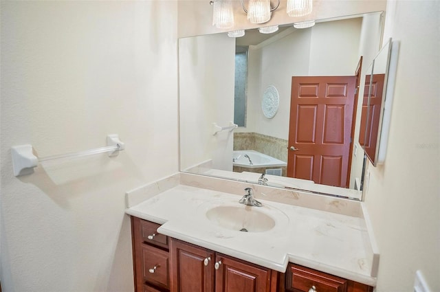 bathroom featuring vanity and a tub