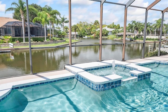 view of swimming pool featuring a water view, a lanai, and an in ground hot tub