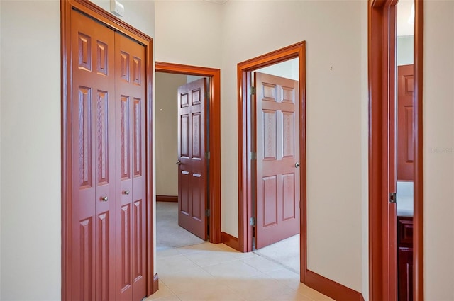 hall featuring light tile patterned floors