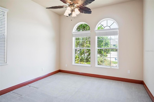 carpeted empty room with ceiling fan