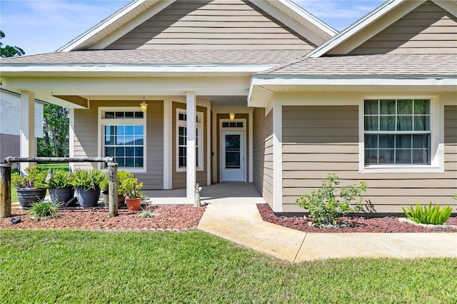 view of front of house with a porch and a front lawn