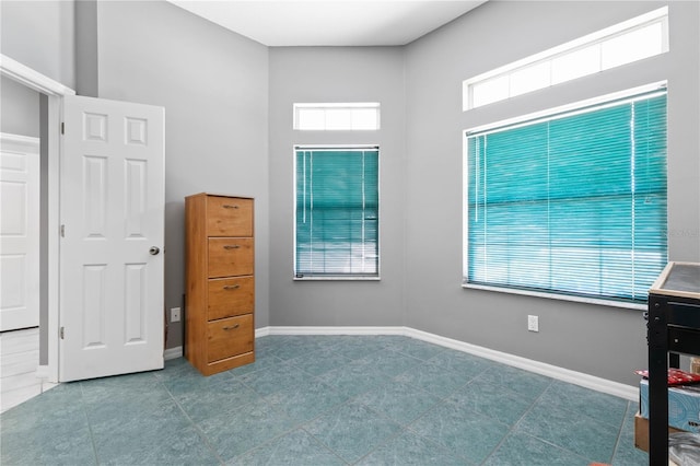 bedroom featuring multiple windows and tile patterned flooring