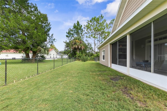 view of yard with a sunroom