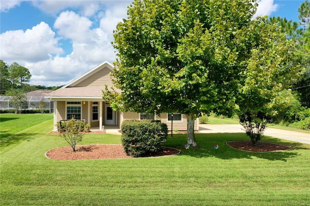 obstructed view of property with a front lawn