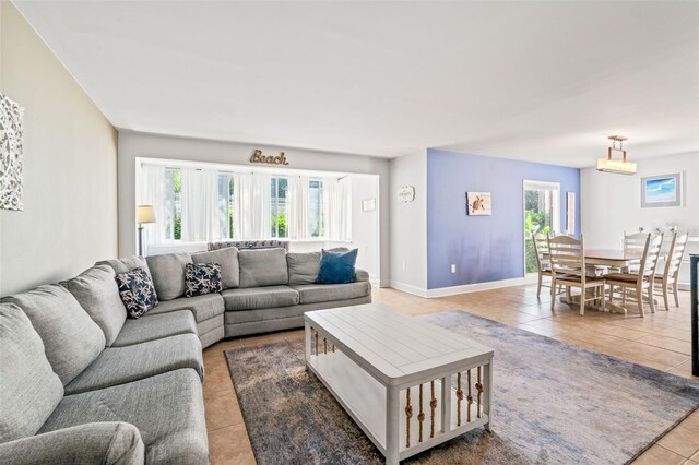 living room with plenty of natural light and tile patterned floors