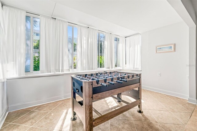 game room featuring light tile patterned floors