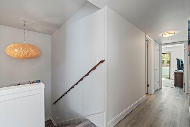 hallway with wood-type flooring