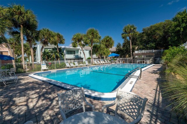 view of swimming pool featuring a patio area